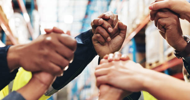 Support, warehouse and business people with shipping, teamwork and logistics with compliance. Group, employees and coworkers with closeup, motivation and backlog with stock, industry and supply chain