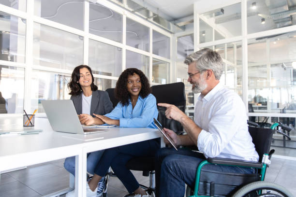 istock Determined businesswoman with coworkers using technology 2174298302
