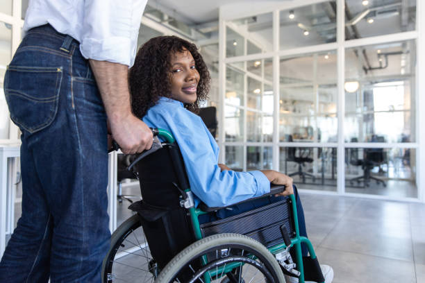 istock Disabled woman sitting in modern office chair 2174298349