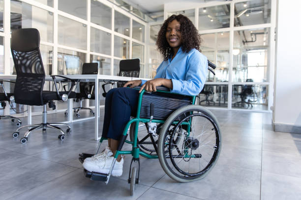 istock Female professional with disability working indoors from office 2174298441