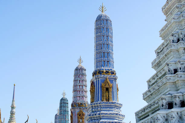 Stunning view of colorful pagodas rising against a clear blue sky. This vibrant architecture showcases intricate designs and reflects rich cultural heritage.
