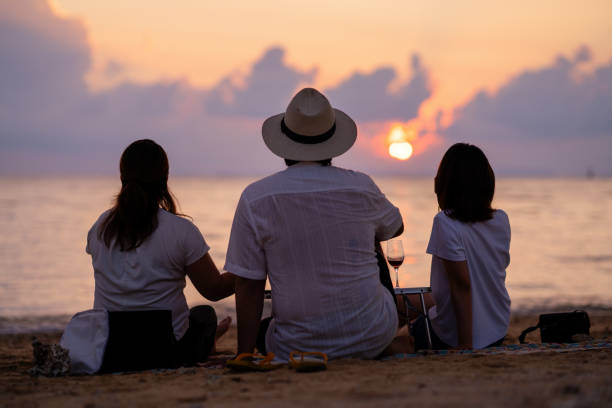 istock Three mid adult friends watching the sunset 2174306675