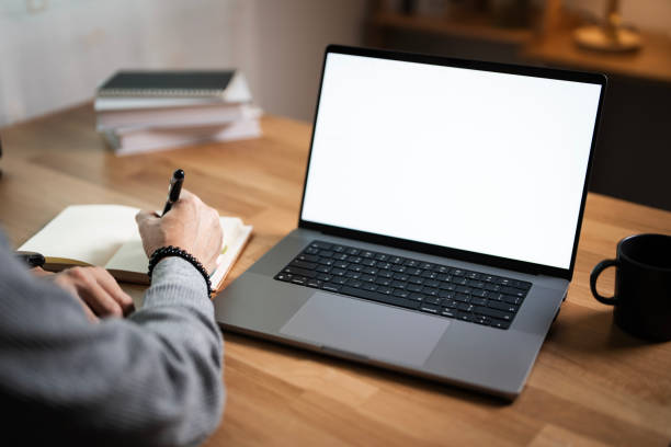 istock Man working with planning project, using laptop blank screen mockup, sitting at home office. 2174308439