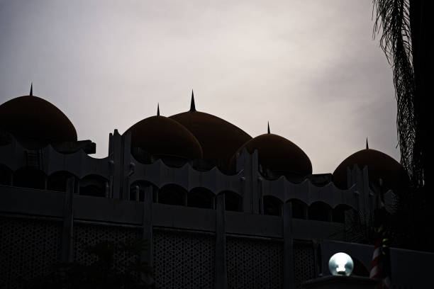 Captured against the light, the religious building appears both powerful and mysterious, in a perfect balance between shadow and light.