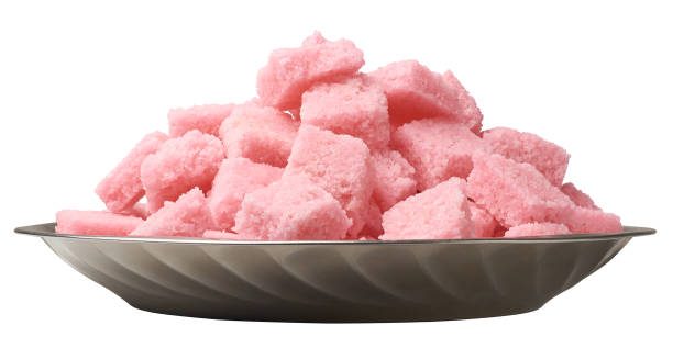 istock coconut toffees on plate isolated white background 2174311071