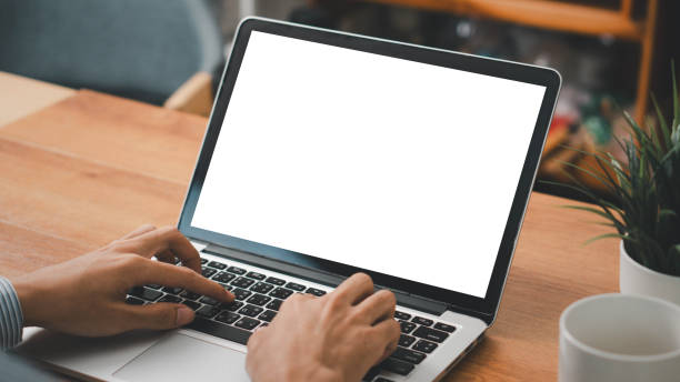 istock Mockup laptop computer. hand man work using laptop with white background for advertising,contact business search information on desk at coffee shop.marketing and creative design 2174313832