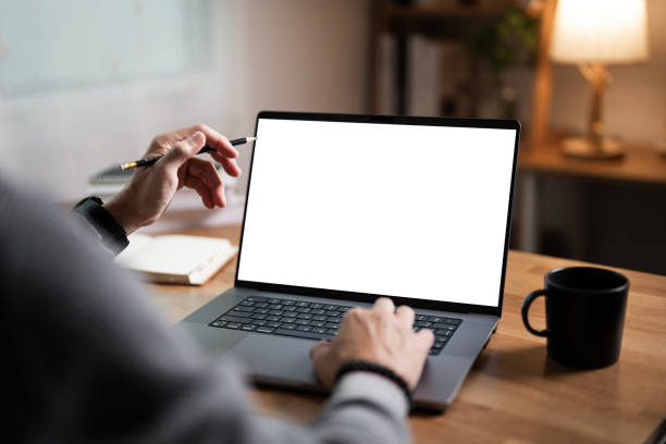 Man hand with blank white screen laptop, business man working on laptop computer at home office. Man hand with blank white screen laptop, business man working on laptop computer at home office. students laptops stock pictures, royalty-free photos & images