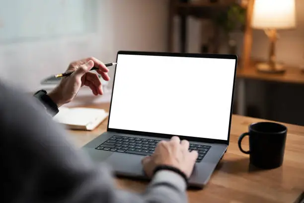 Man hand with blank white screen laptop, business man working on laptop computer at home office. Man hand with blank white screen laptop, business man working on laptop computer at home office.
