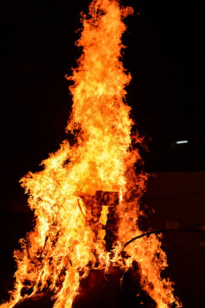 istock Fire flames on black background, Blaze fire flame texture background, Beautifully, the fire is burning, Fire flames with wood and cow dung bonfire 2174316911