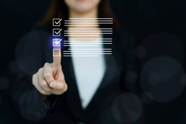 istock Businesswoman is touching on check box in virtual holographic. 2174317855