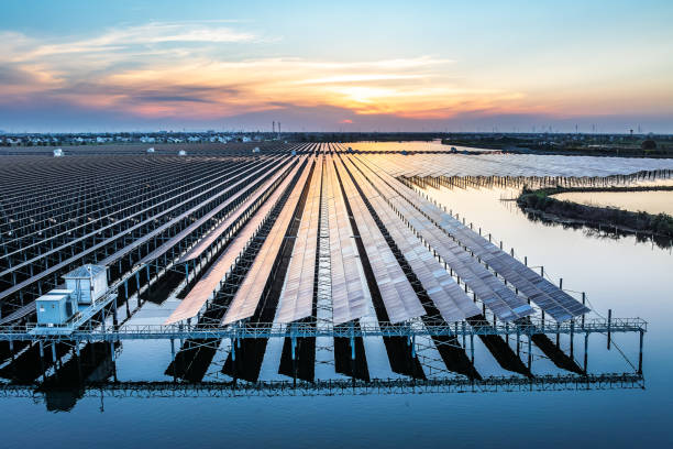 istock Solar power plant in the lake at sunset 2174323859