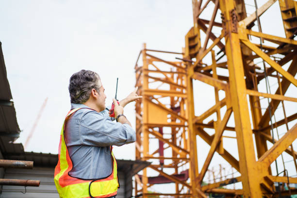 istock Careless worker at construction site without wearing helmet. 2174325169