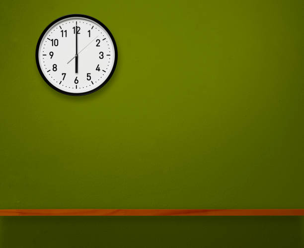 Alarm clock aginst pink background