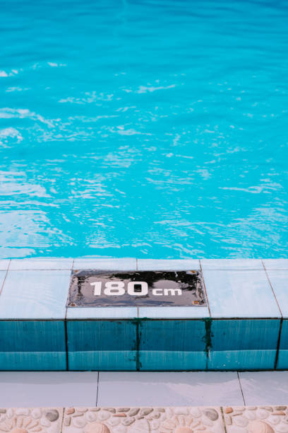 istock Crystal-clear water in a swimming pool, reflecting a pristine and inviting atmosphere for relaxation 2174329762