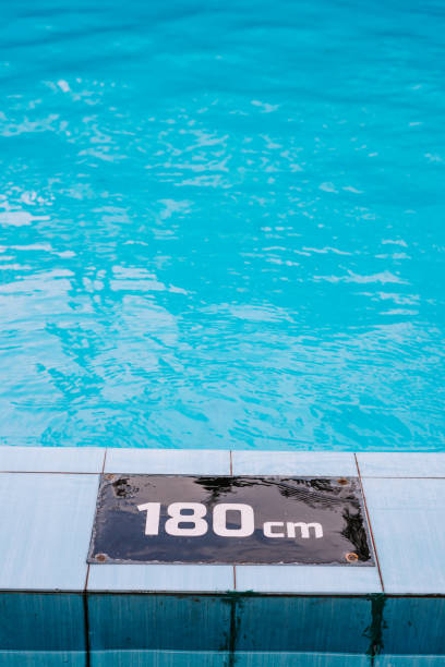 istock Crystal-clear water in a swimming pool, reflecting a pristine and inviting atmosphere for relaxation 2174329772