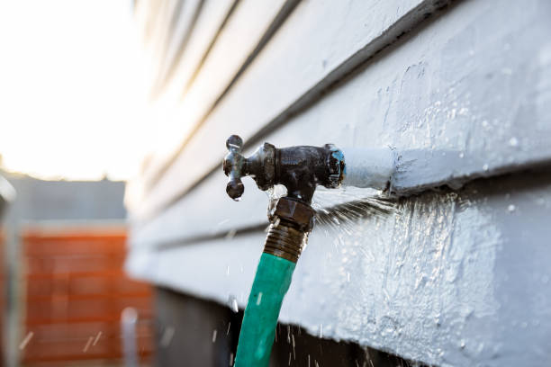 istock Dripping Leaky Outdoor Faucet with Hose 2174334771