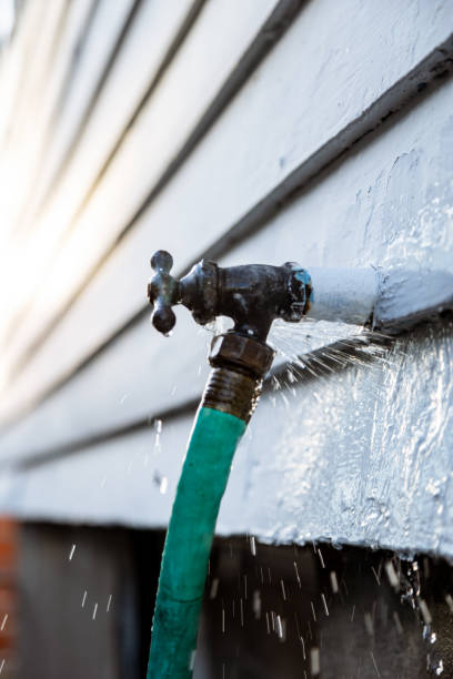 istock Dripping Leaky Outdoor Faucet with Hose 2174334782