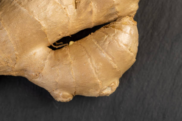 a ginger root on the table, details of the ginger root used in cooking, closeup
