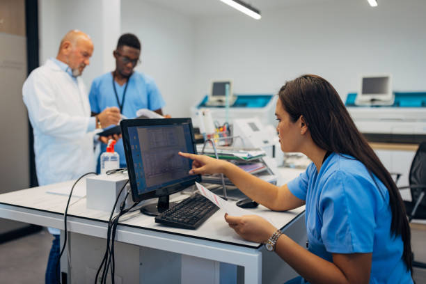 istock A multiracial group of biochemists work together in the laboratory, examine analyses, discuss, collaborate 2174336187
