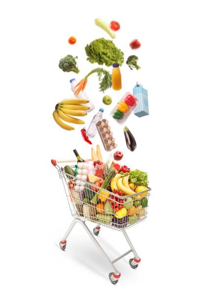 istock Different food products falling into a shopping cart 2174338471