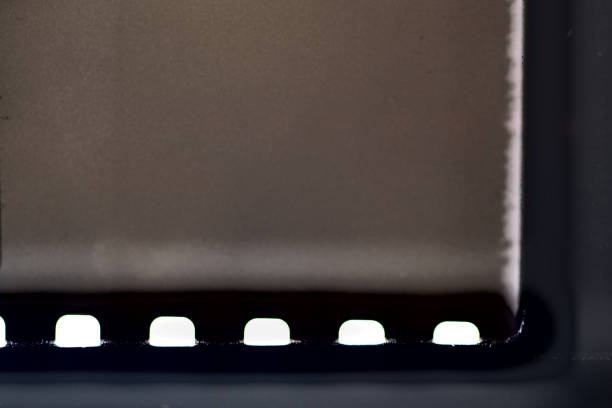 Film strip texture with blank space. pieces of long 35mm negative film strip isolated, real scan