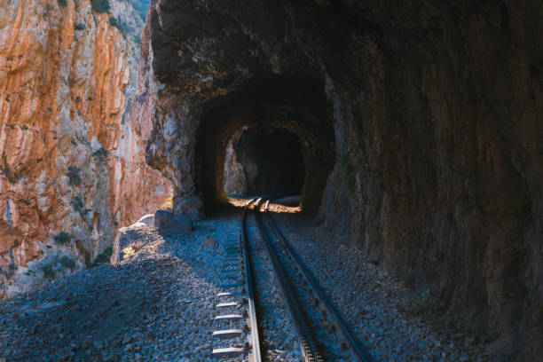 istock A train track leading from one mountain cave into the next in Greece 2174341304