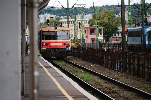 istock Old red and yellow train at a railway station 2174341722