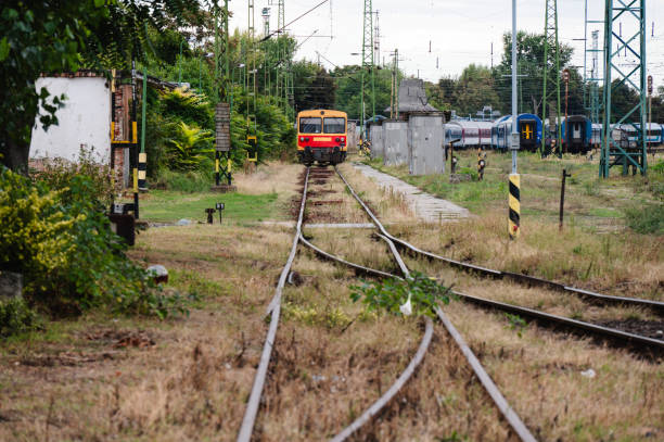 istock Old red and yellow train at a railway station 2174341777
