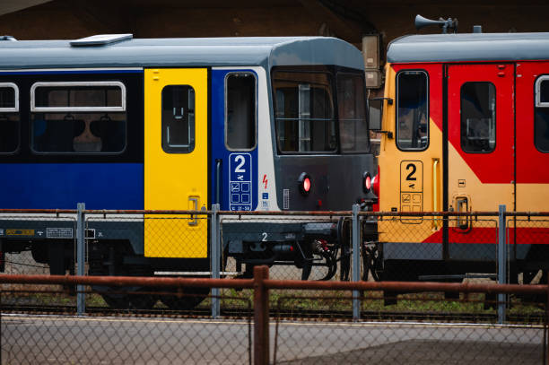 istock Old red and yellow train at a railway station 2174341785
