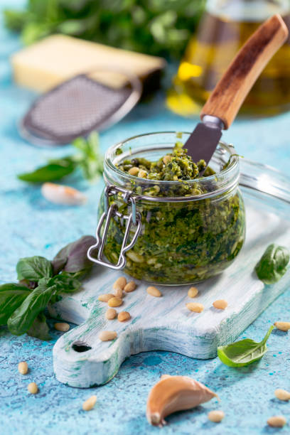 istock Small jar of homemade basil pesto. 2174343997