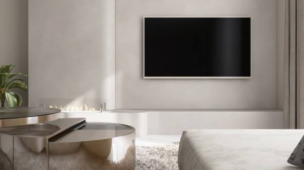 istock Front view of black flat screen television on beige wall with sofa, coffee table in living room in sunlight from sheer, brown blackout curtain for interior design decoration, product background 3D 2174346710
