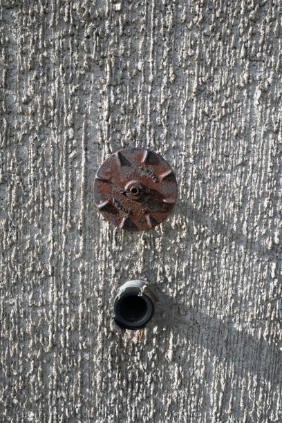 istock sprinkler system connections outside of a building exterior wall 2174346949