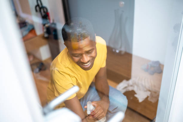 istock Diligent Home Maintenance by Cheerful Black Man 2174349469