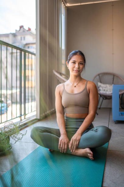 istock Tranquil Home Yoga Session with Asian Female 2174349984