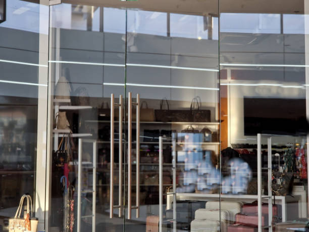 istock store front with metal handles. glass windows must be polished and washed regularly 2174352173