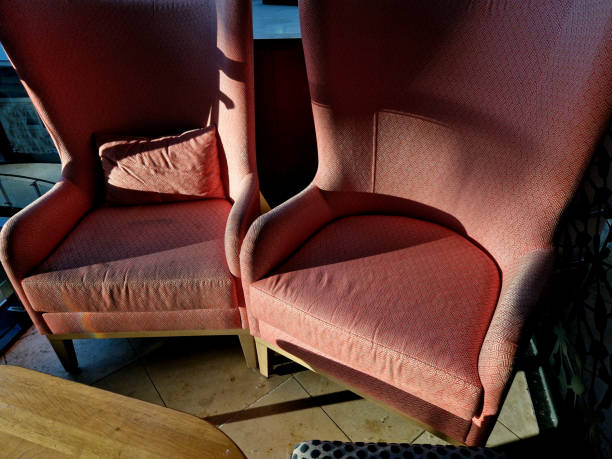 istock Victorian high back upholstered chairs with armrests. pink shiny cover with buttons 2174352449