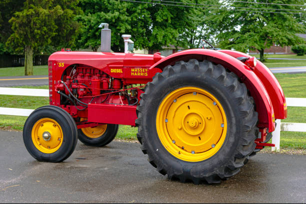 Glendale, Kentucky, USA-June 22, 2017:  Antique cherry red Massey-Harris 55 tractor sitting outside.
