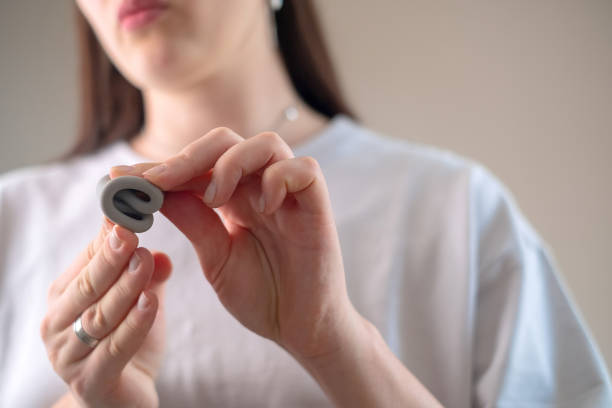 istock Using a menstrual cup during menstruation, with women's health products including vitamins and supplements for support. 2174358791