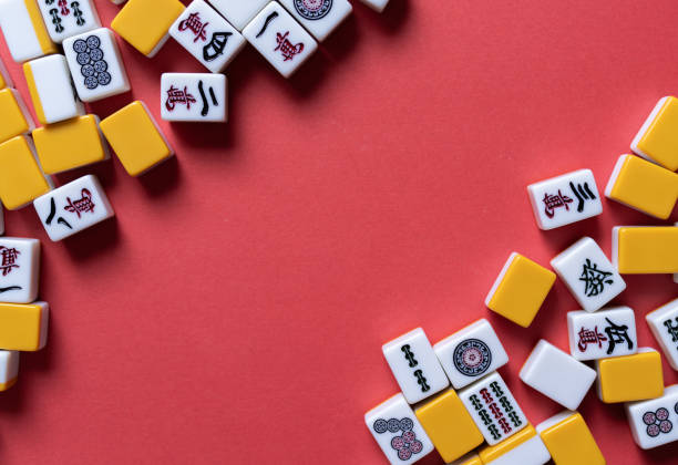 istock Mahjong tiles background on red background 2174359555