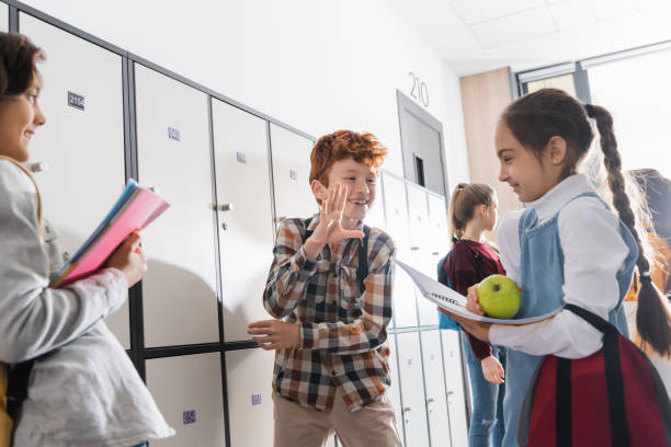istock Joyful schoolchildren engaged in collaborative learning in a bright and modern classroom 2174360591