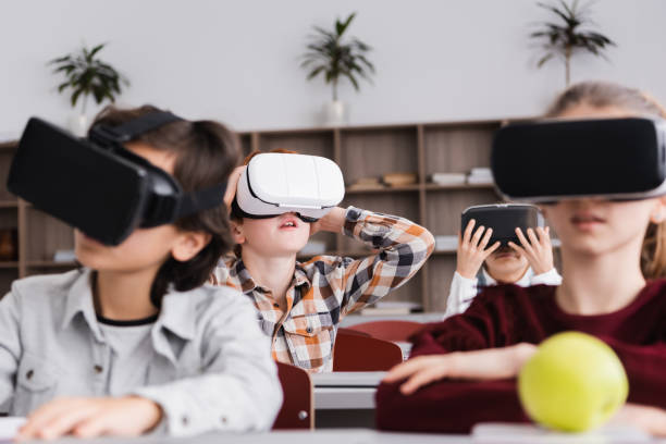 istock Engaging schoolchildren immersed in virtual reality learning fun in a modern classroom 2174360907