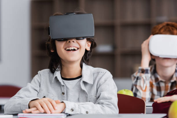 istock Excited schoolchildren immersed in virtual learning in a modern classroom setting 2174361474