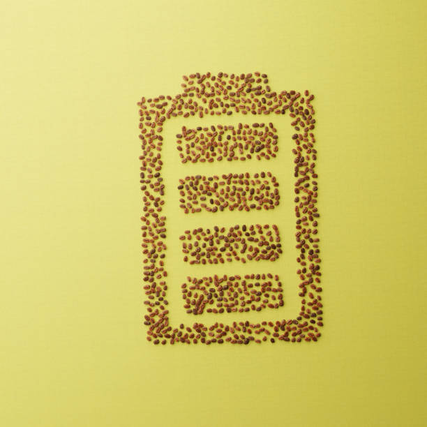 A creative CGI composition of coffee beans arranged in the shape of a battery icon, symbolizing the energetic boost associated with coffee. Perfect for symbolizing the energy boost or jolt of alertness that coffee provides.