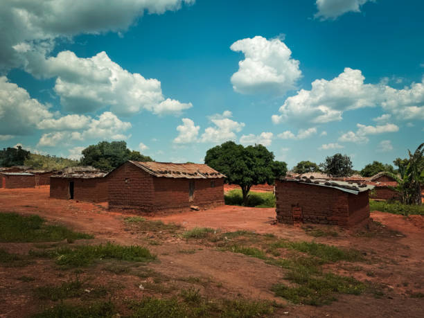 istock A rustic village in Angola with traditional mud huts under a bright blue sky 2174363429