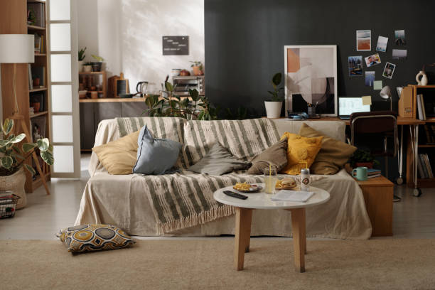 istock Table with fast food in living room 2174363877