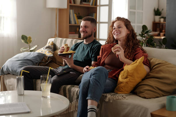 istock Relaxing on couch in front of tv set 2174363881