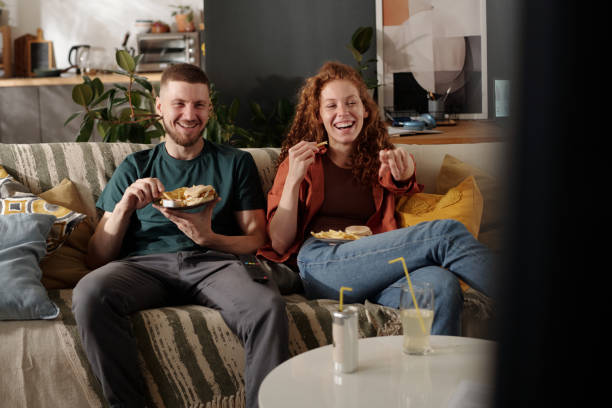 istock Eating and laughing in front of tv 2174363888