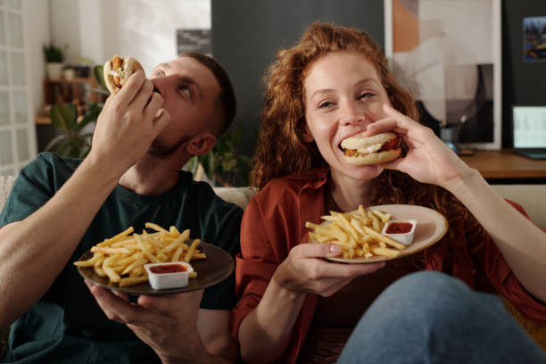 Biting hamburgers and enjoying lunch