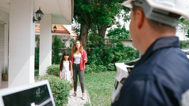 istock Qualified technician working with laptop for home EV station. Synchronos 2174365419
