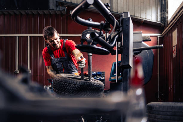 istock Changing car tires for winter season. 2174366393